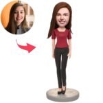 Cartoon avatar of a woman in a red top and black pants standing on a round base, created from the real photo shown in the top-left.”
