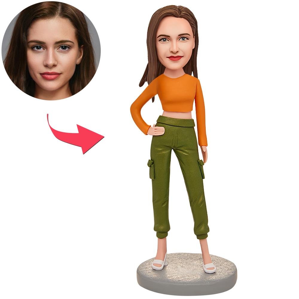BH945jpg - printshop4me.ae Custom avatar model: cartoon woman in orange top and green cargo pants on a round base, with a circular inset photo to map a real face onto the avatar face.