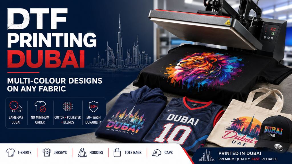 DTF Printing Dubai hero image showing a heat press lifting film from a colourful design on a black t-shirt, with custom apparel options like jerseys, hoodies, tote bags, and caps.
