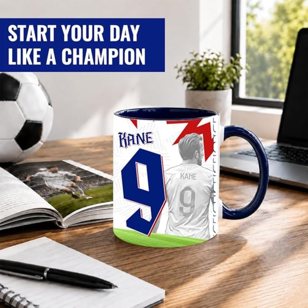 11 Oz Mug - printshop4me.ae Harry Kane England football player ceramic mug with number 9 design displayed on an office desk beside a football, notebook, and laptop, suitable for coffee, tea, and everyday use.