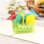 8bdcb49aff51265634bf890ee7ec3535webp - printshop4me.ae Easter eggs 3D pop-up greeting card featuring colorful decorative eggs, butterflies, spring grass, and floral accents. This handcrafted paper pop-up card opens to reveal a vibrant Easter scene, making it a charming keepsake and thoughtful greeting card for Easter celebrations, spring gifts, and seasonal décor.
