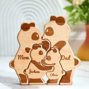 CBS0P214X03jpg - printshop4me.ae Personalized wooden panda family puzzle featuring four interlocking panda figures engraved with the names “Mom,” “Dad,” “Jackson,” and “Olivia.” Crafted from natural wood with engraved details, this custom family keepsake is displayed on a tabletop in a bright home setting.