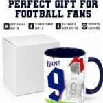 Football Graphic Mug - printshop4me.ae Harry Kane England football player ceramic mug with number 9 jersey design and blue handle, displayed with gift box packaging, suitable for football fans, sports enthusiasts, and everyday beverage use.