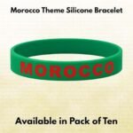Green silicone wristband with red “MOROCCO” text, shown as a single bracelet product image labeled “Morocco Theme Silicone Bracelet” with note indicating availability in pack of ten.