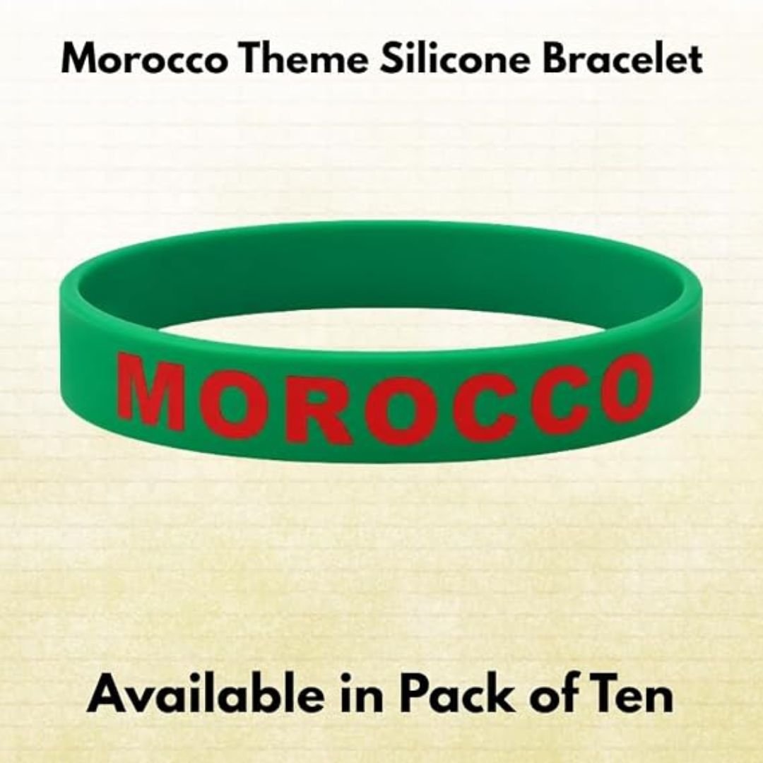 Green silicone wristband with red “MOROCCO” text, shown as a single bracelet product image labeled “Morocco Theme Silicone Bracelet” with note indicating availability in pack of ten.