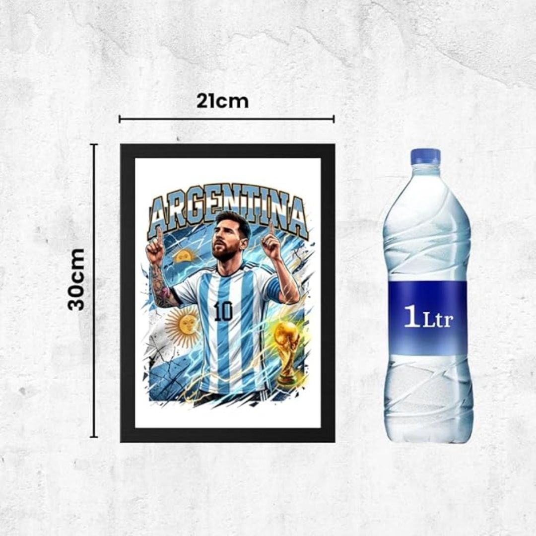 "Framed Argentina football poster featuring Lionel Messi in the Argentina jersey, raising his arms in celebration with a golden World Cup trophy and Sun of May in the background, dimensions 21 cm x 30 cm, shown next to a 1-liter water bottle for size reference."