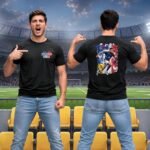 France football player men's black dry-fit T-shirt worn in a stadium, featuring a small France 2026 front logo and large France soccer player graphic on the back.