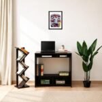 Modern interior sports artwork - printshop4me.ae "England football player celebrating goal in white national team kit with number 9, FIFA World Cup trophy, framed wall poster above a black desk with laptop, bookshelf, and green plant in modern home office."