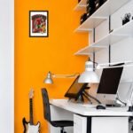 Morocco football player photo frame displayed on an orange office wall above a modern workstation, featuring soccer-themed wall art in a home office setup.