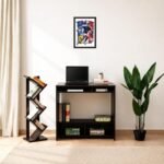 France football player photo frame displayed above a study desk with laptop, bookshelf, and indoor plant, featuring soccer-themed wall art for home office decor.