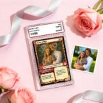 A personalized “magic card” style couple gift displayed in a clear protective case on a pink background. The card features a framed couple photo with decorative hearts and romantic text, including names “Luke & Max” and affectionate messages. A second printed couple photo is placed beside it, along with pink roses and satin ribbon, creating a romantic Valentine’s gift presentation.