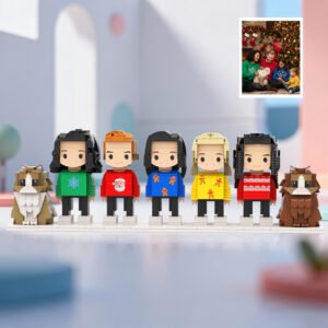 Custom full-body brick figures of five people with two cats, personalized from your family photo. Each mini block character wears festive Christmas-themed clothing, including holiday sweaters and seasonal designs, displayed on a white base with two custom brick cats. A thoughtful personalized keepsake gift for families, Christmas, birthdays, anniversaries, or special occasions.
