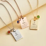Set of personalized calendar pendant necklaces available in silver, rose gold, and gold finishes, each featuring a custom engraved name, special date calendar, delicate flower design, and birthstone charm. Elegant personalized necklaces displayed on matching chains, ideal for anniversaries, birthdays, Valentine's Day, Mother's Day, weddings, or meaningful keepsake gifts.