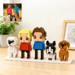 Personalized custom brick figures of a couple and three dogs, recreated from a photo using building blocks. A unique custom family and pet display keepsake, ideal for anniversaries, birthdays, weddings, housewarmings, or gifts for dog lovers.