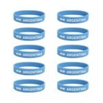Set of 10 Argentina football silicone wristbands, light blue color, printed with Argentina text and soccer ball icon, stretchable and comfortable, fan merchandise for sports events.
